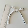 Hand-printed black and white polka dot tassel bow phone case accessories, clothing, hat, shoe flower accessories, children's clothing, shoe flower accessories Application Scenario